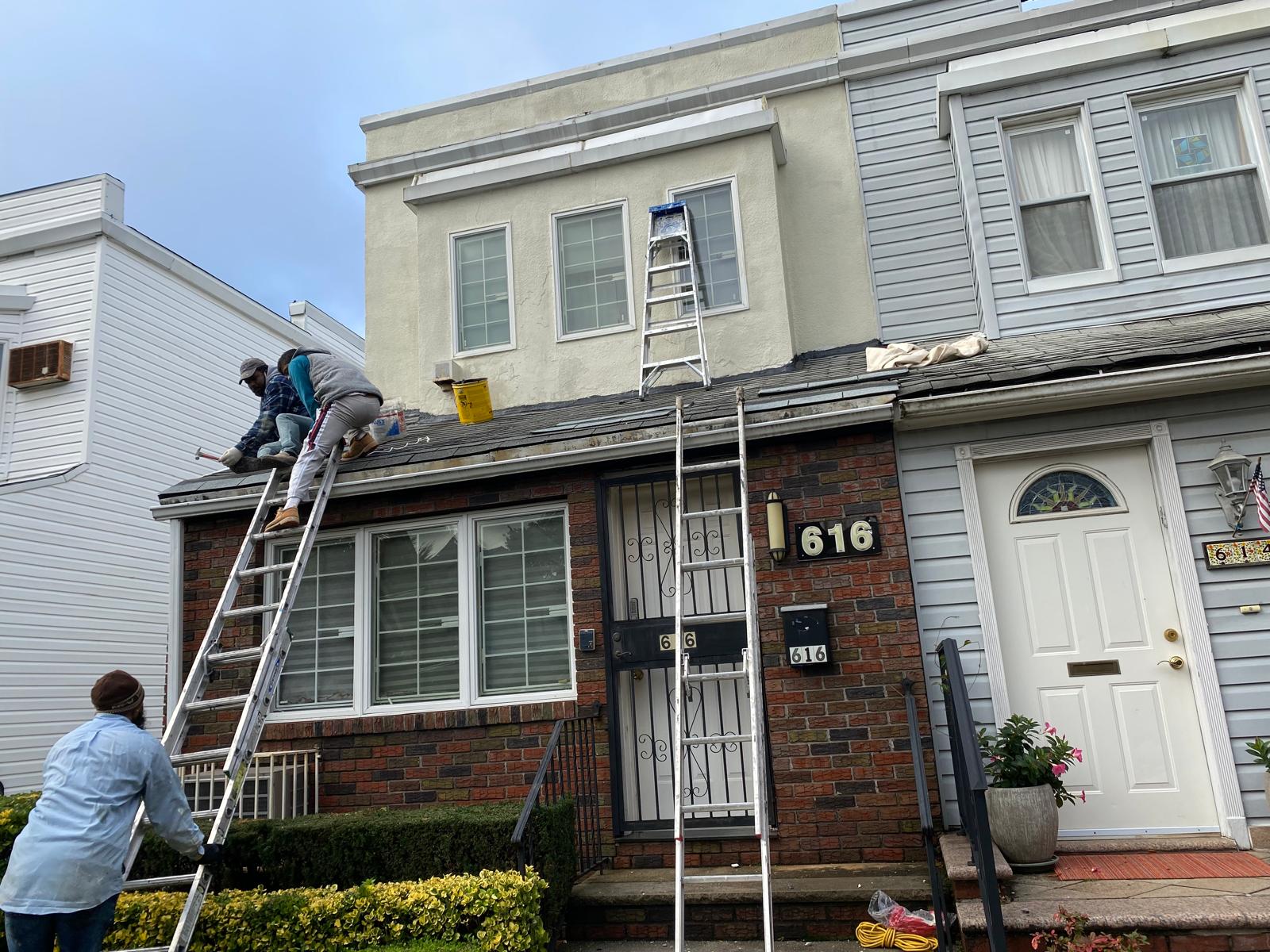 Commercial building roof installation with waterproof coating